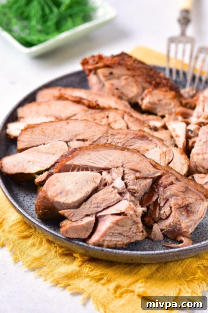 Roast Turkey Thighs (Gluten-Free, Dairy-Free) A plate of perfectly sliced, juicy turkey meat ready to serve.
