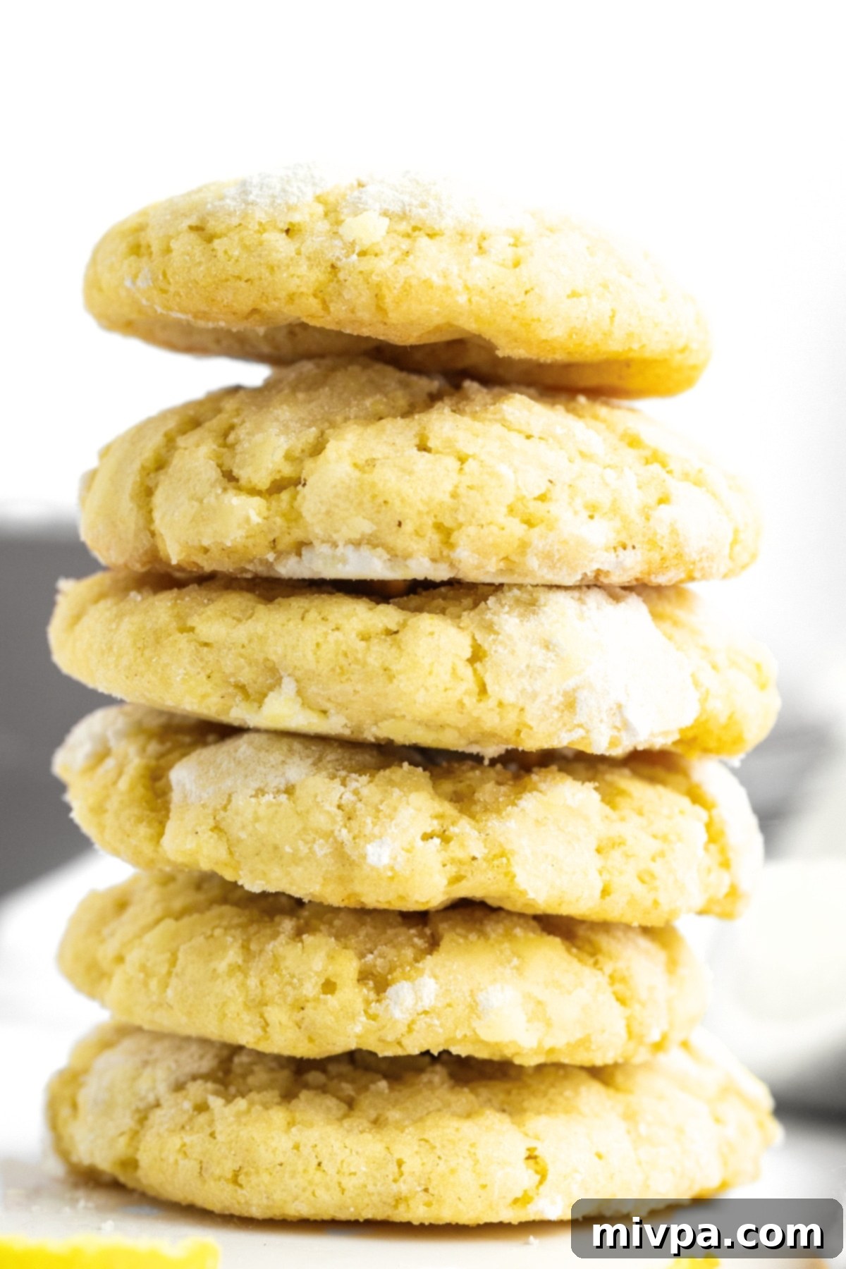 A stack of gluten-free lemon crinkle cookies.
