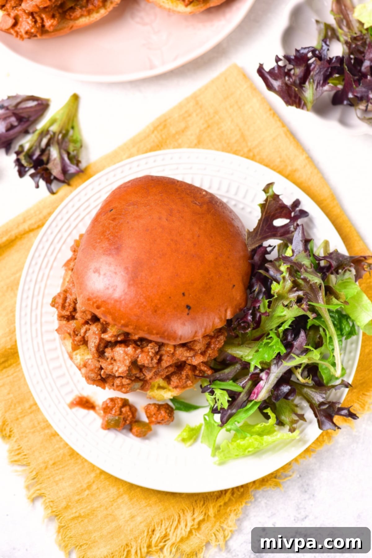 Dairy-Free Sloppy Joes (Gluten-Free) Top down view of a plate of sloppy joe and salad.