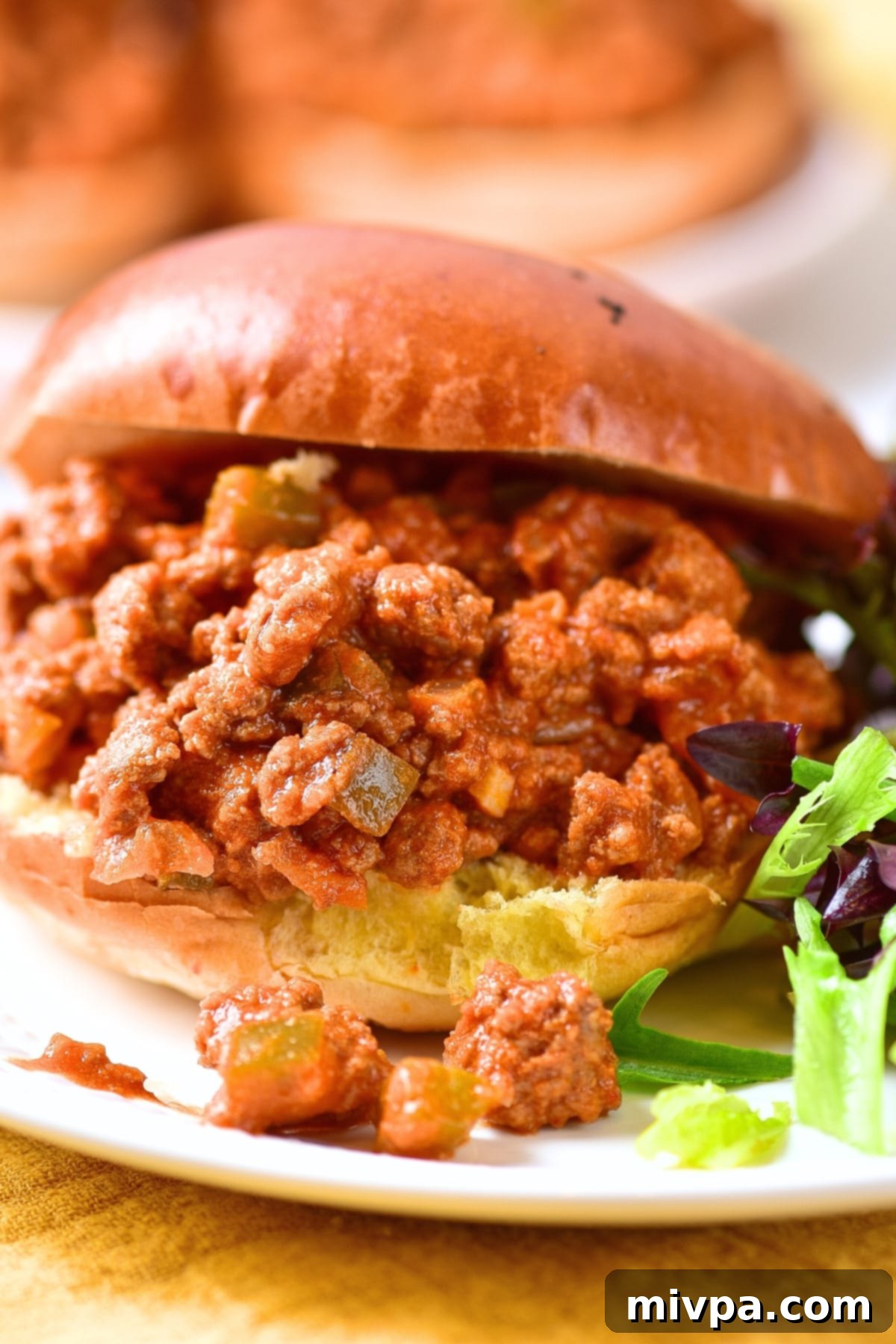 Gluten-Free Sloppy Joe Recipe (Dairy-Free) Up close shot of a gluten-free sloppy joe sandwich.