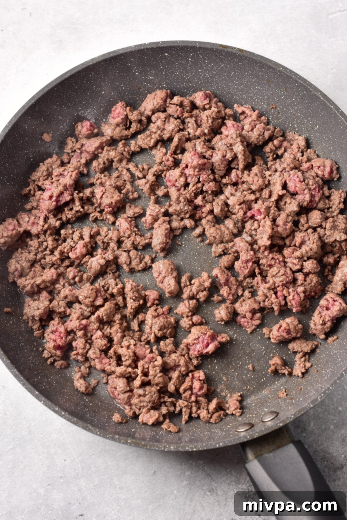 Ground Beef Sloppy Joes (Gluten-Free, Dairy-Free) Sautéing ground beef in skillet.