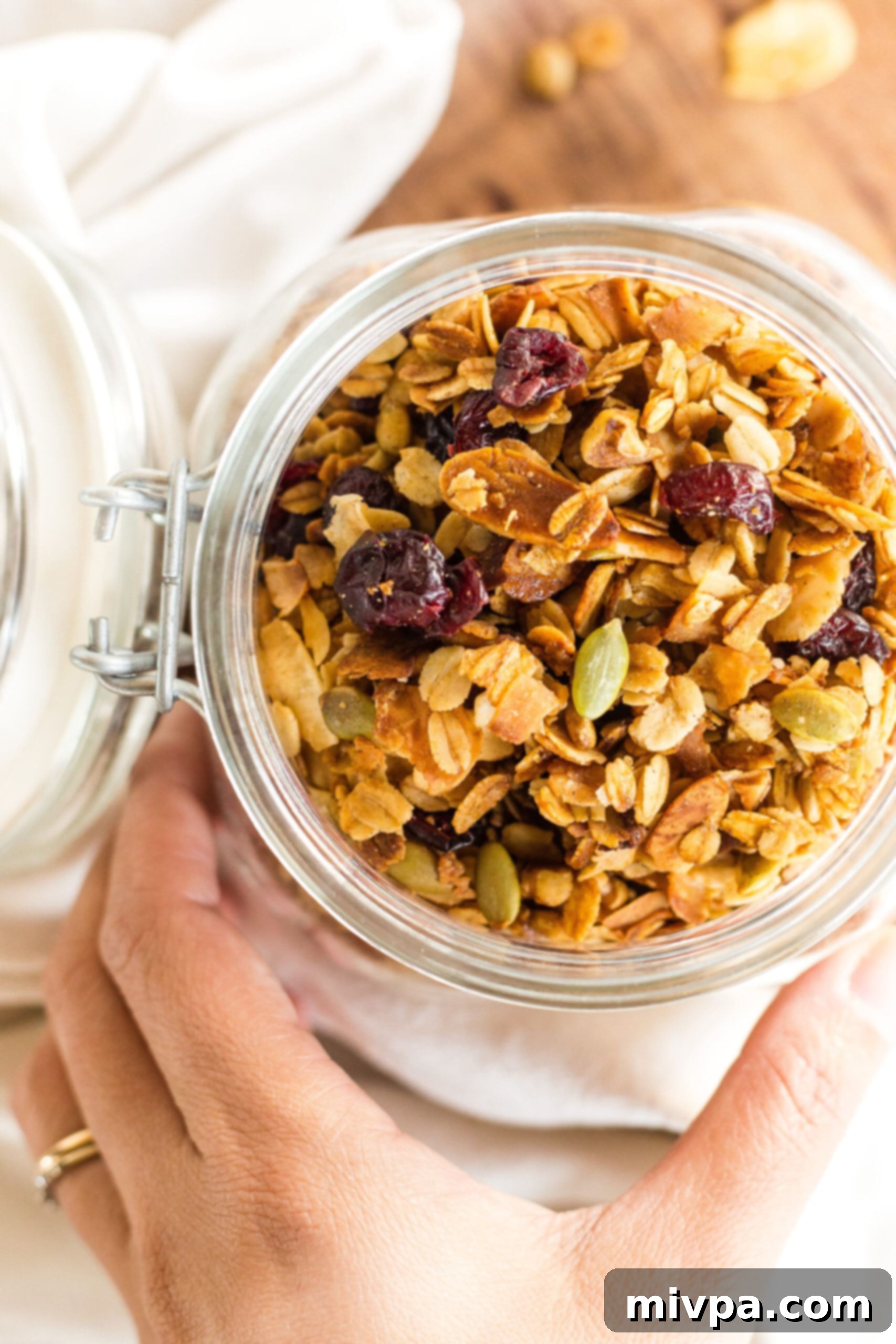 Homemade Granola (Gluten-Free, Vegan) Top down view of a jar of homemade granola (gluten-free).