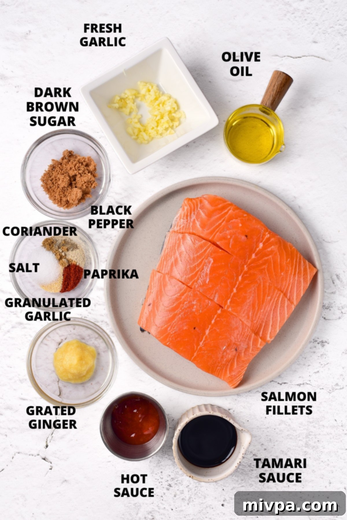 All the essential ingredients for making the spicy firecracker salmon recipe, neatly laid out on a wooden cutting board.