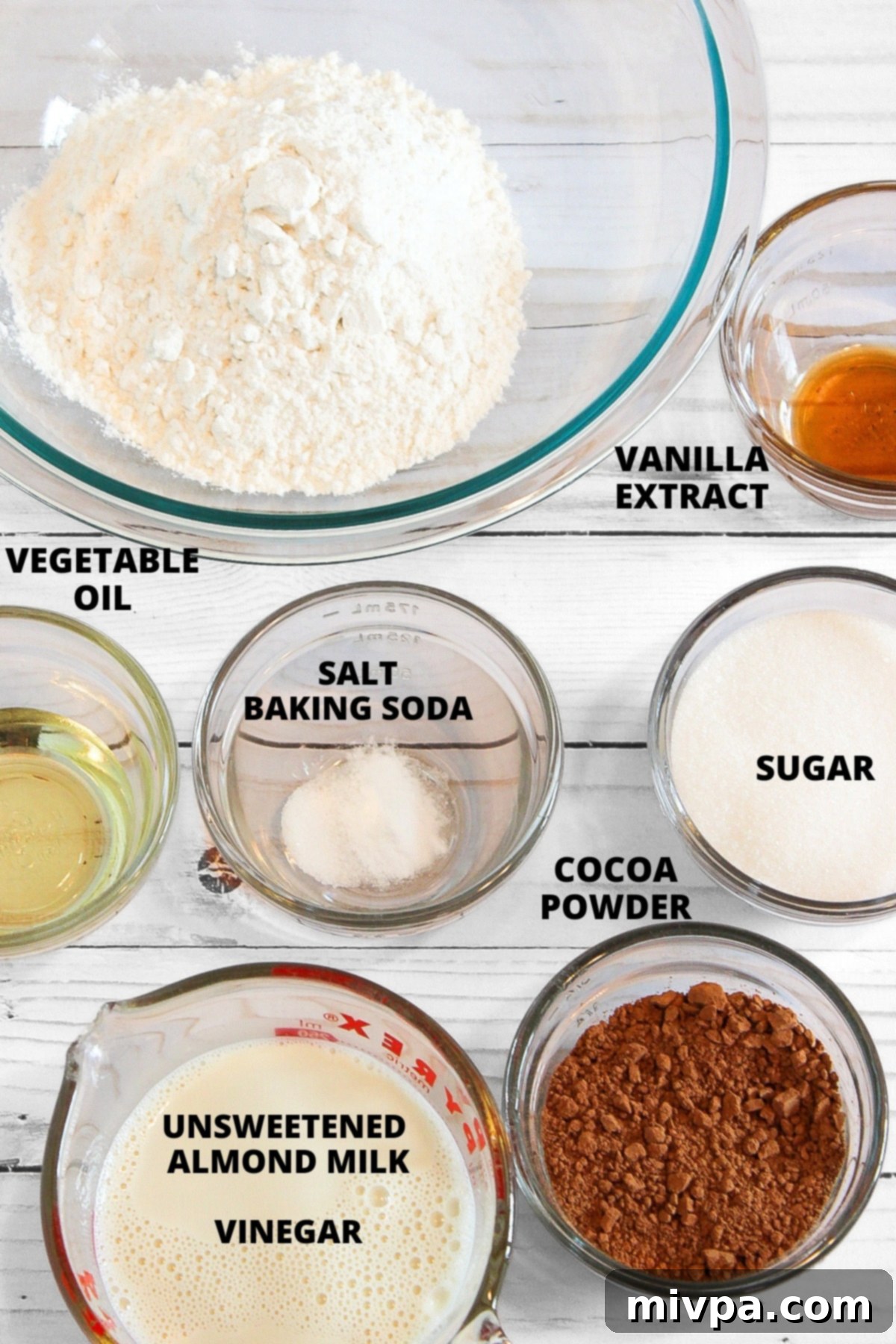 Top down view of dry and wet ingredients for moist gluten-free chocolate cupcakes recipe, neatly laid out.