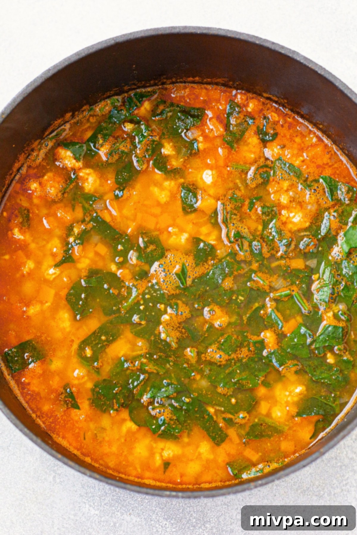 Chickpea and Kale Soup (Gluten-Free, Dairy-Free) Cooking chickpea kale soup in large pot.