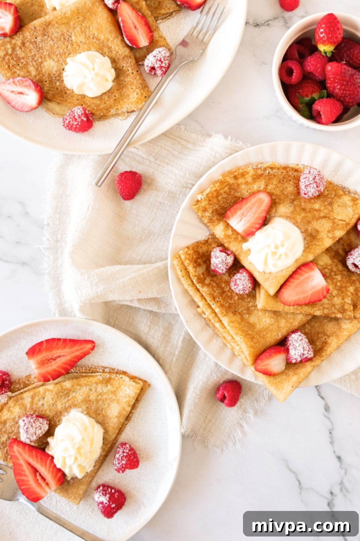 Recipe for Gluten-Free Crepes (Dairy-Free) Top down view of plates of gluten-free crepes.