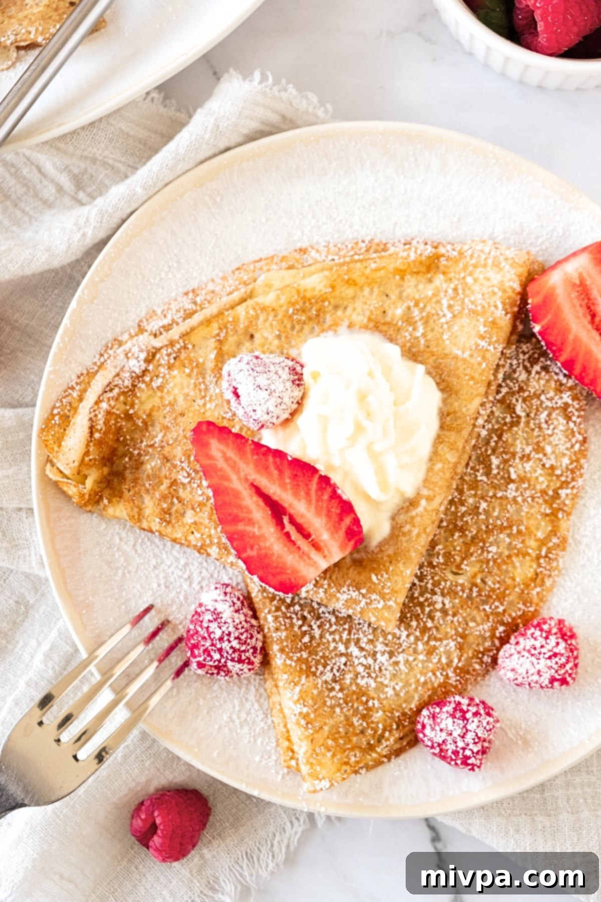 Top down view of a plate of gluten-free crepes.