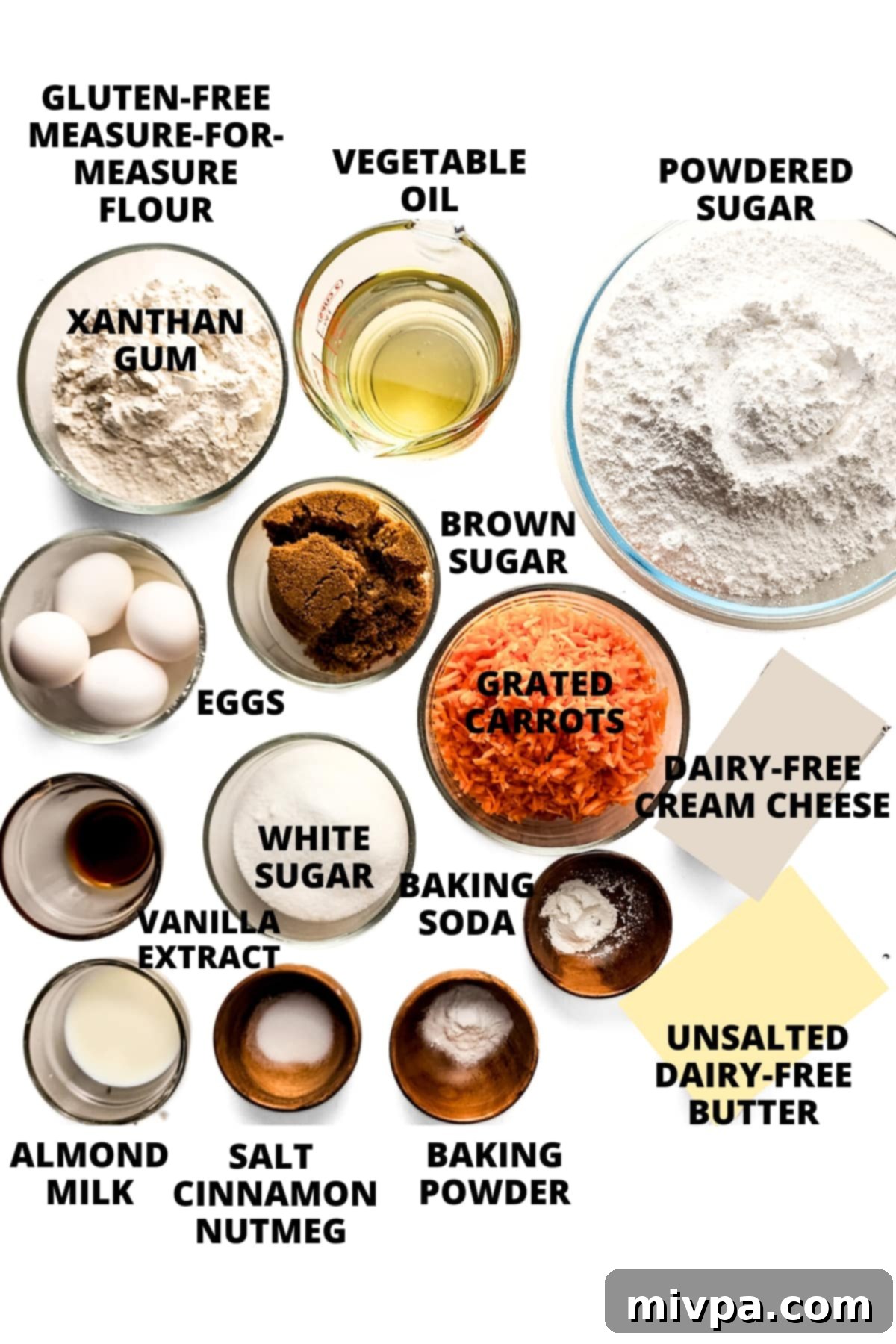 Gluten-Free Carrot Cake recipe (Dairy-Free) Ingredients for gluten-free carrot cake recipe laid out on white board.