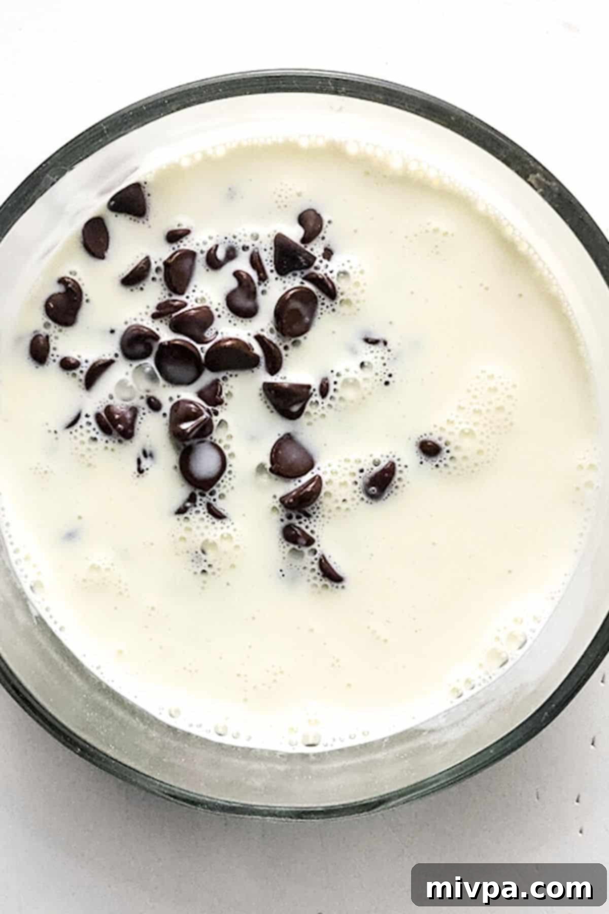 Gluten and Dairy-Free Chocolate Cake Chocolate chips in bowl of milk