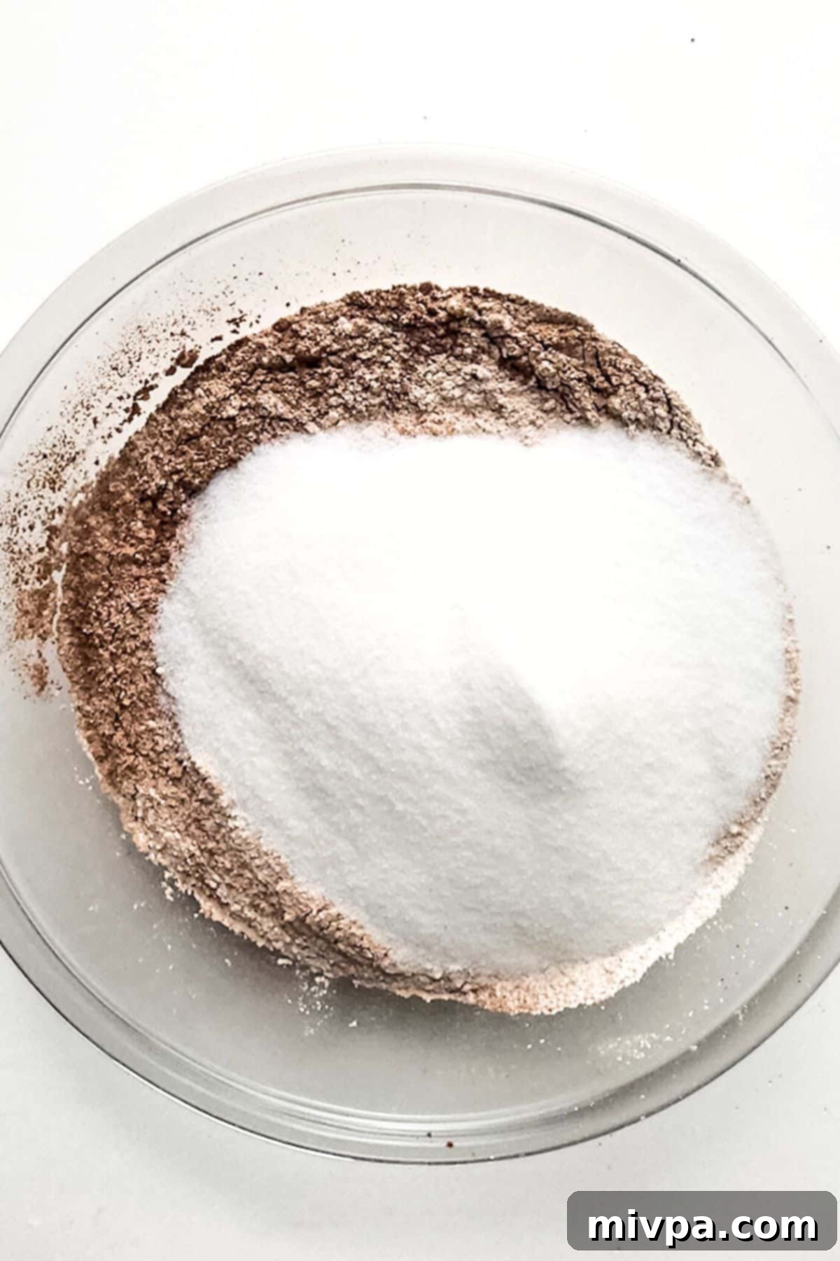Gluten and Dairy-Free Chocolate Cake Dry ingredients in glass mixing bowl.