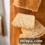Fluffy Gluten and Dairy-Free Beer Bread 2 Slices of fluffy gluten-free beer bread on a wooden board.