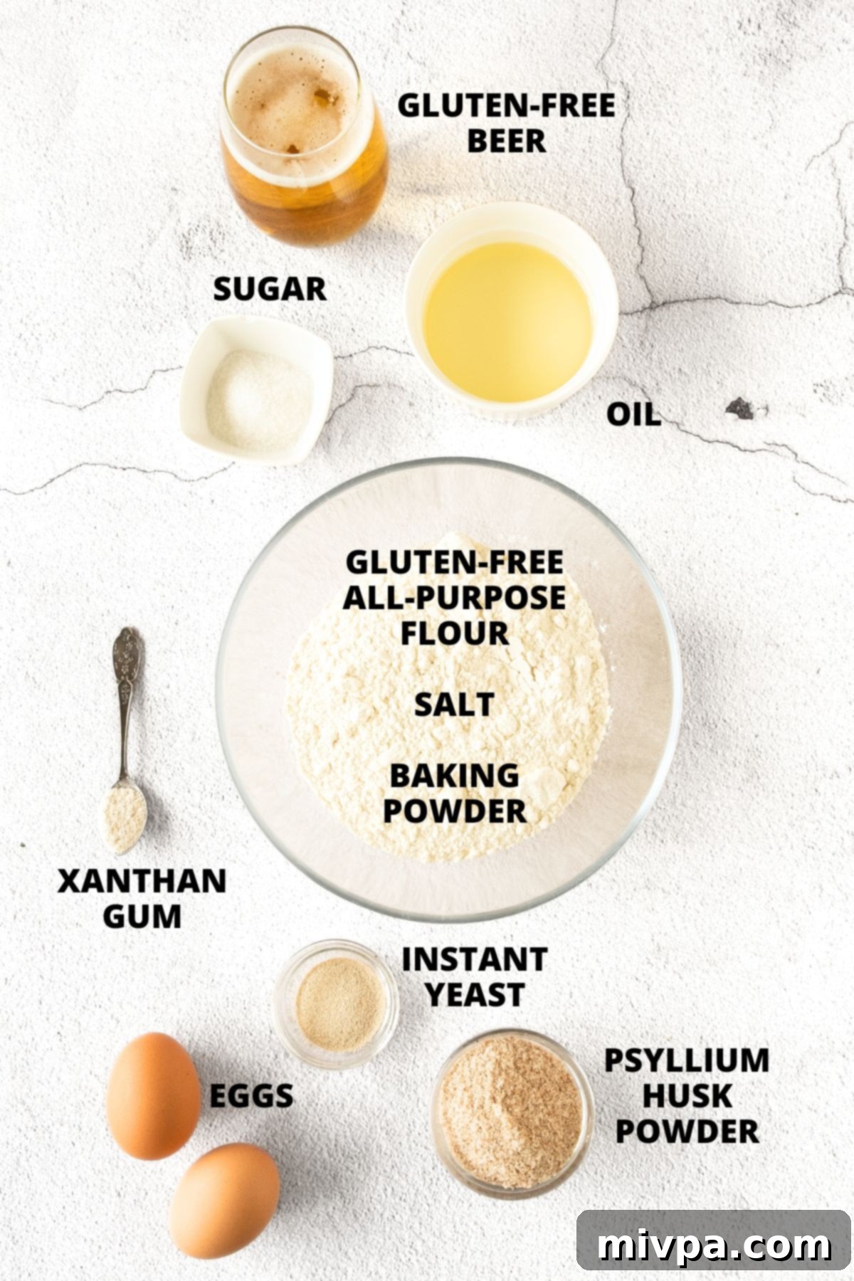 Gluten-Free Beer Bread Recipe (Dairy-Free) All ingredients for gluten-free beer bread recipe neatly laid out on a clean white board.