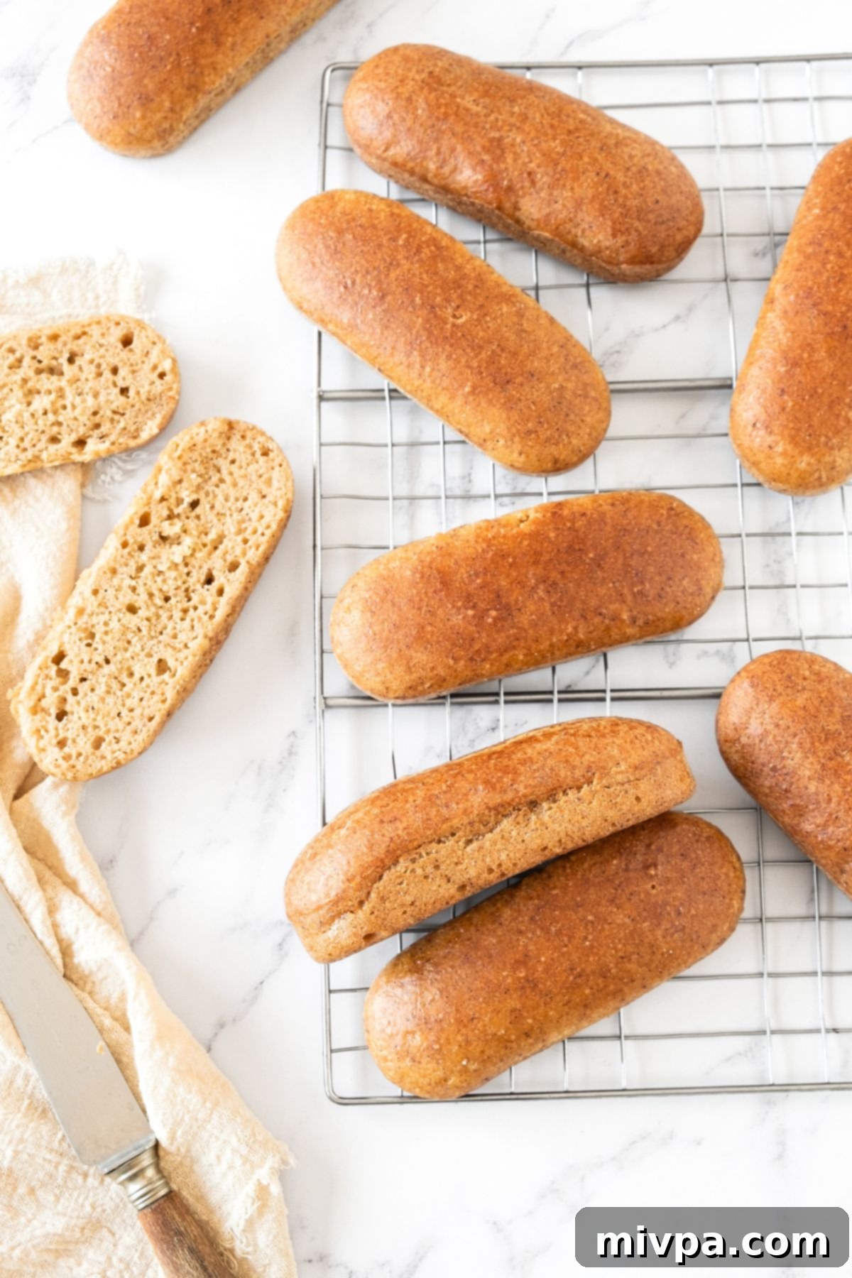 Easy Homemade Hot Dog Buns GF Hot dog buns on cooling rack.