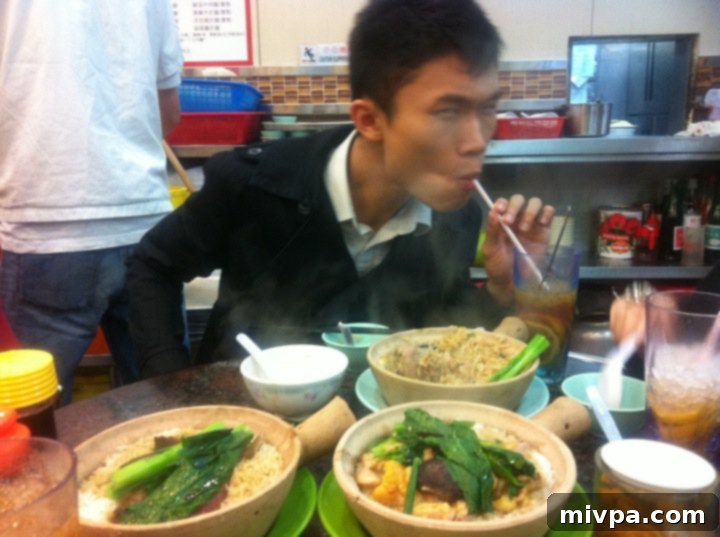 The Why Behind My Food Photography 6 Author's brother Ronald savoring Hong Kong's famous ice lemon tea and claypot rice.