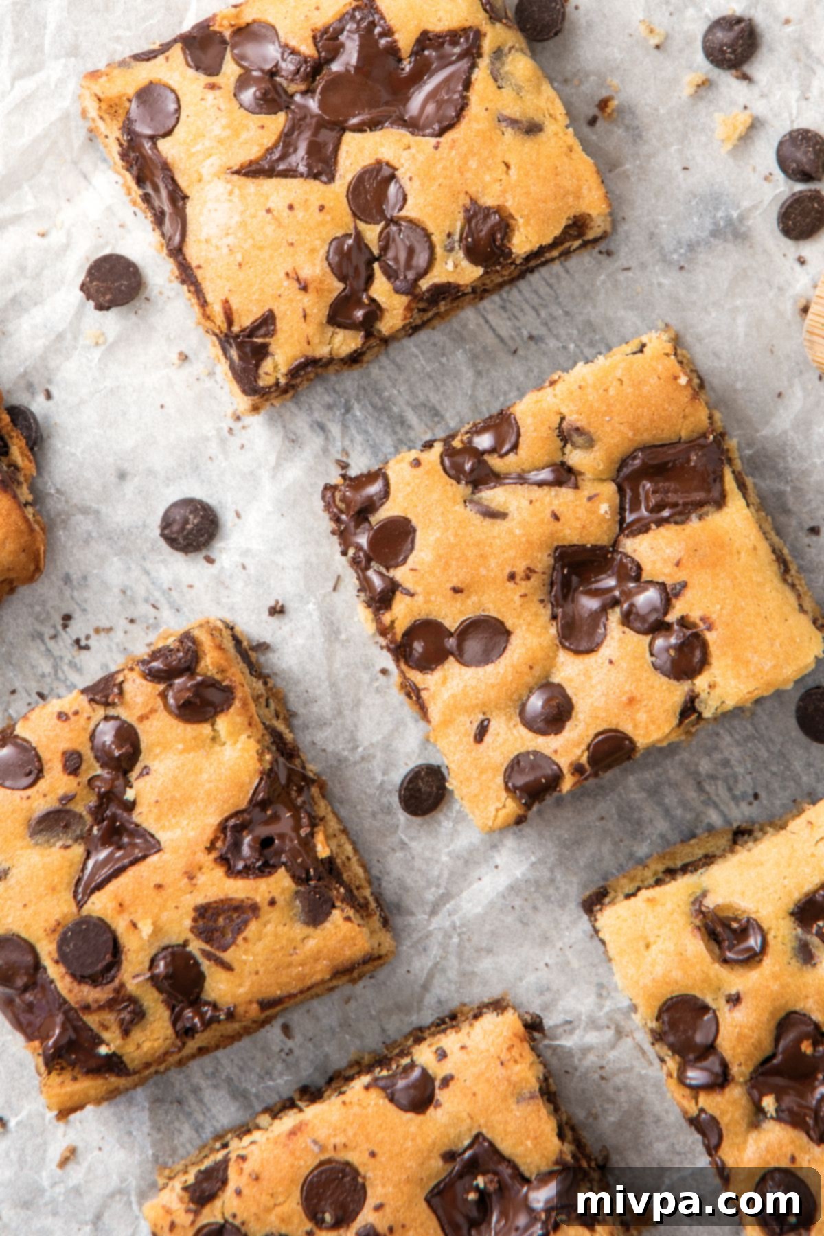 Gluten-Free Chocolate Chip Bars Close Up Up close shot of individual gluten-free chocolate chip bars, showcasing the melted chocolate and texture.
