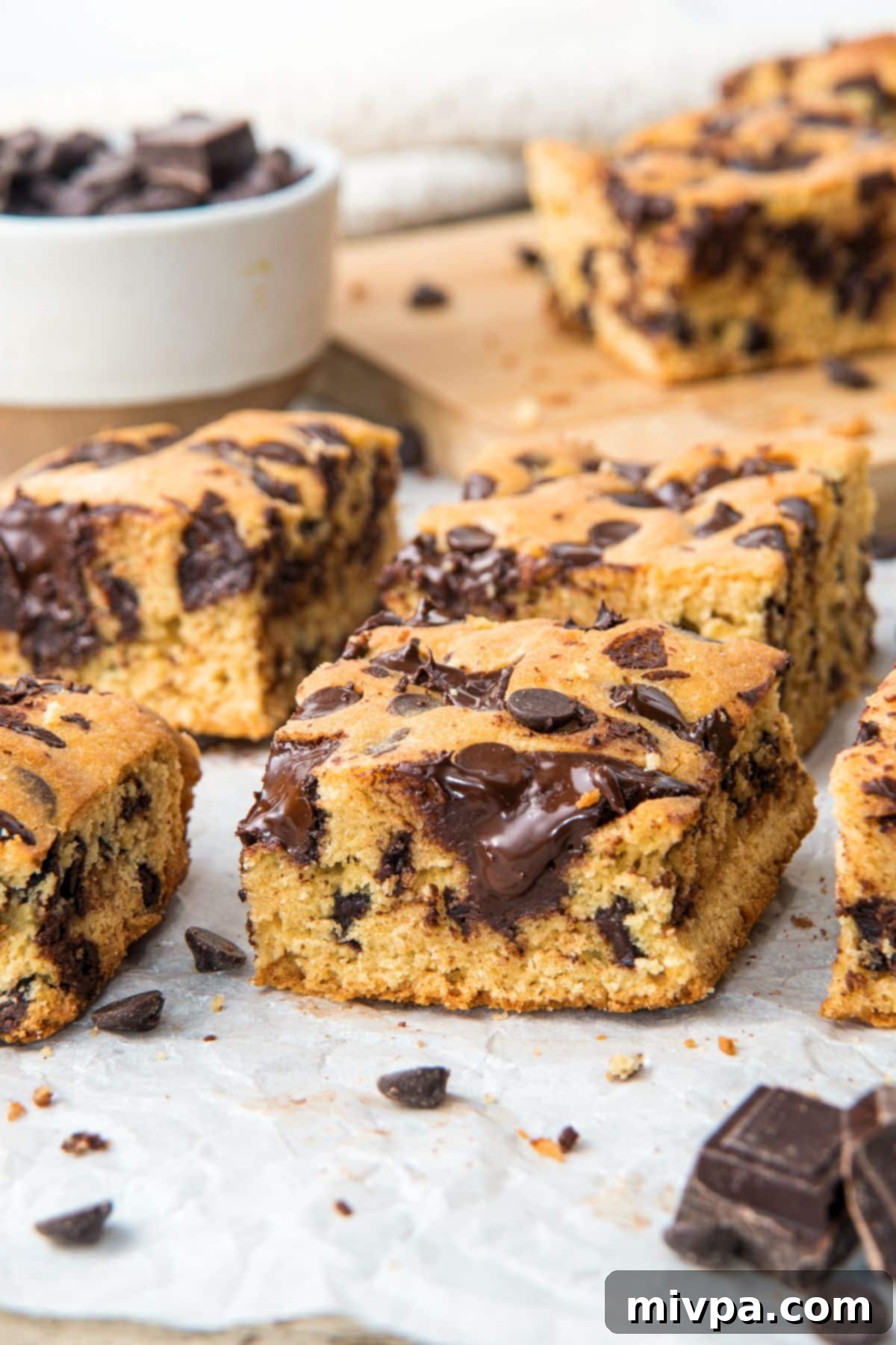 Cookie Bars with Melted Chocolate Close Up Up close shot of warm cookie bars oozing with melted chocolate, showing a rich, soft texture.
