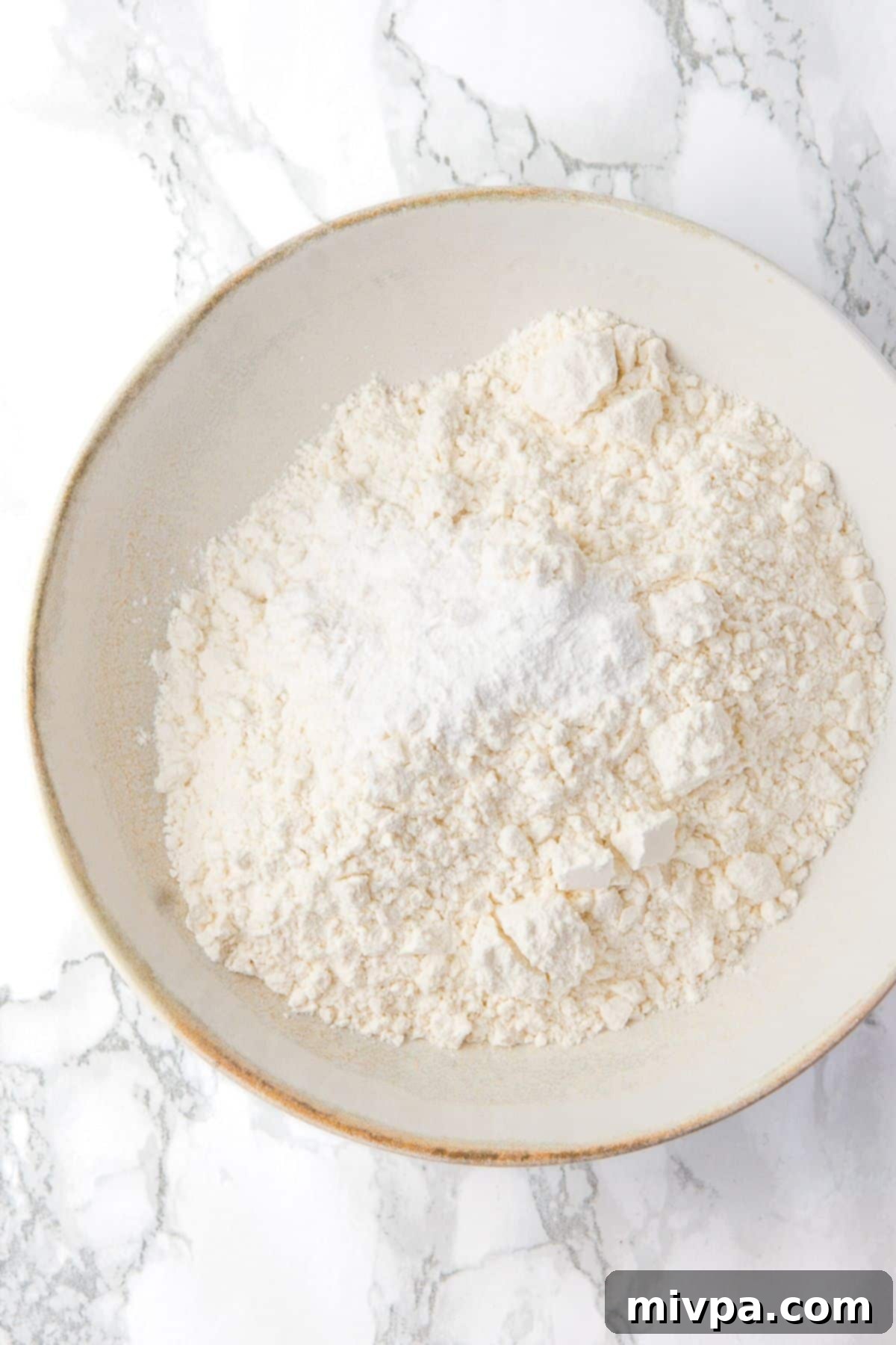 Dairy-Free Chocolate Chip Cookie Bars (Gluten-Free) - Dry Ingredients Dry flour mixture in a white bowl, ready to be combined with wet ingredients.