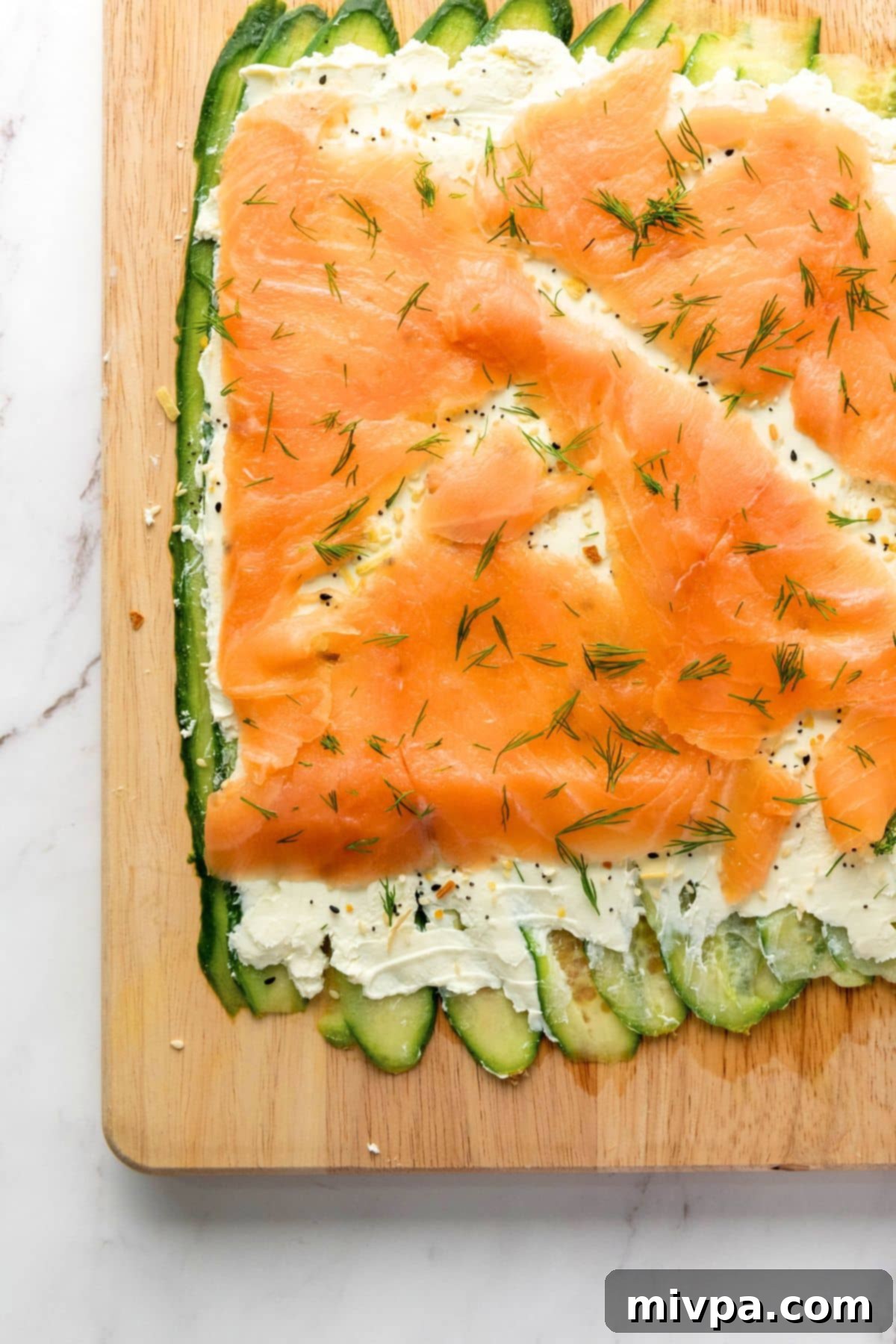 Cucumber Cream Cheese Rolls Cucumber slices topped with cream cheese and smoked salmon