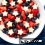 Stars and Stripes Fruit Medley Gluten Free Vegan 2 A bowl of patriotic fruit salad on blue cloth.