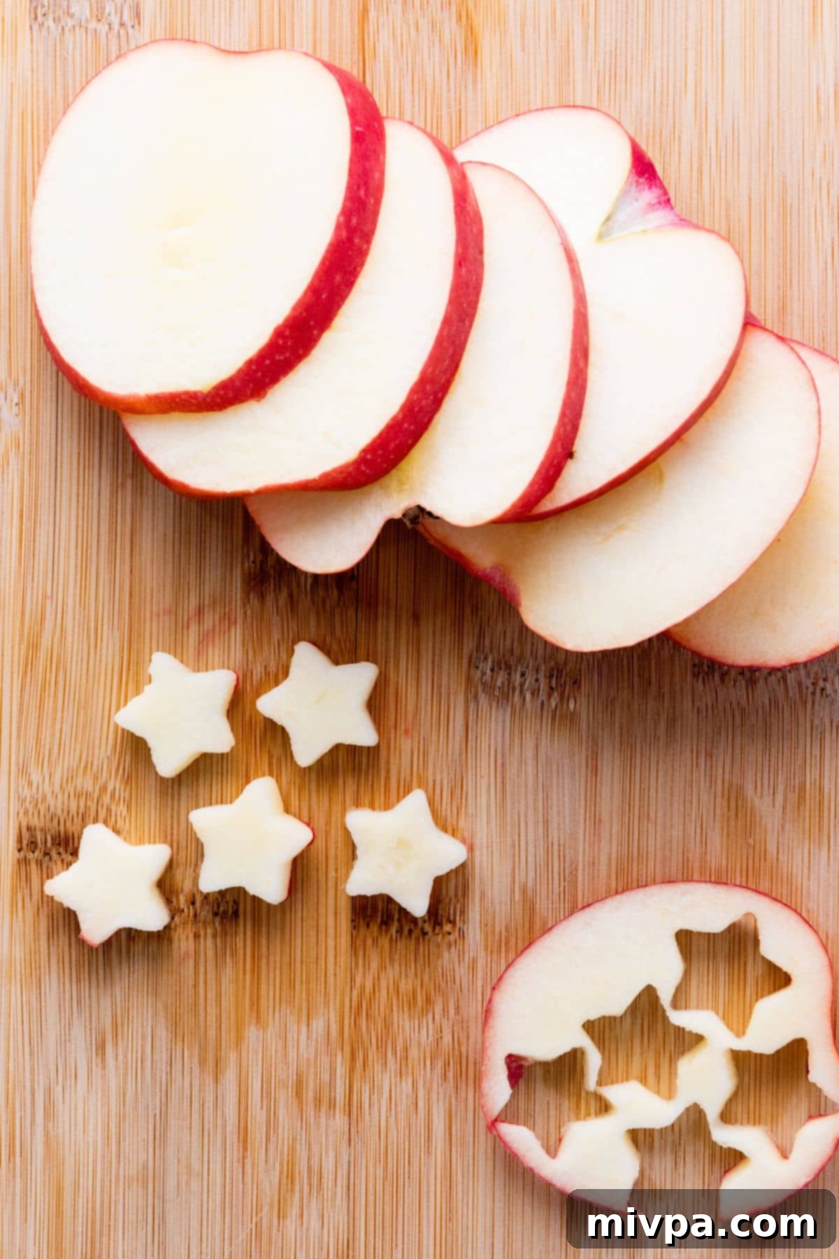 4th of July Fruit Salad Cutting out star shapes from apple slices.
