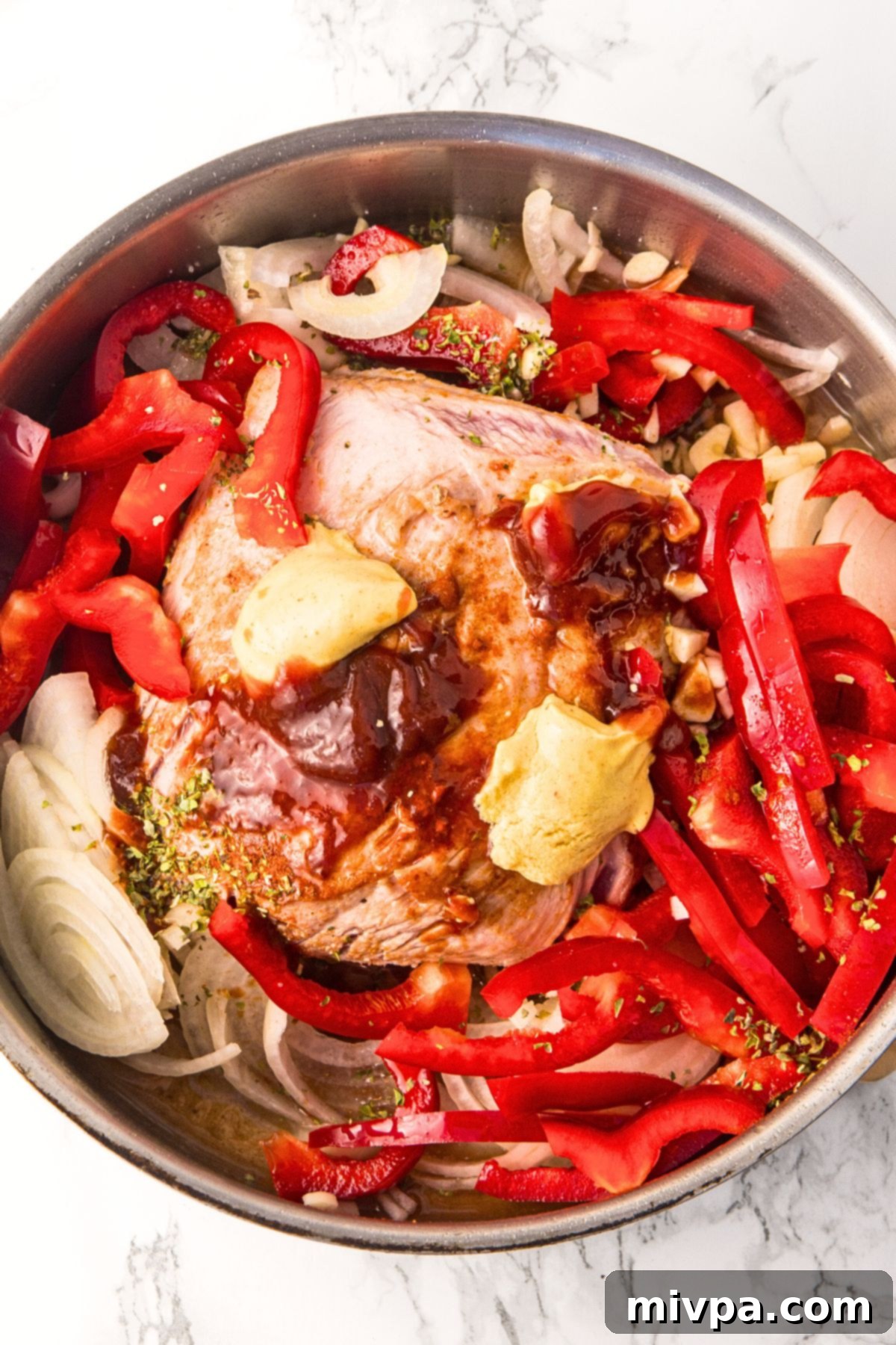 A pot with pork and sliced veggies.