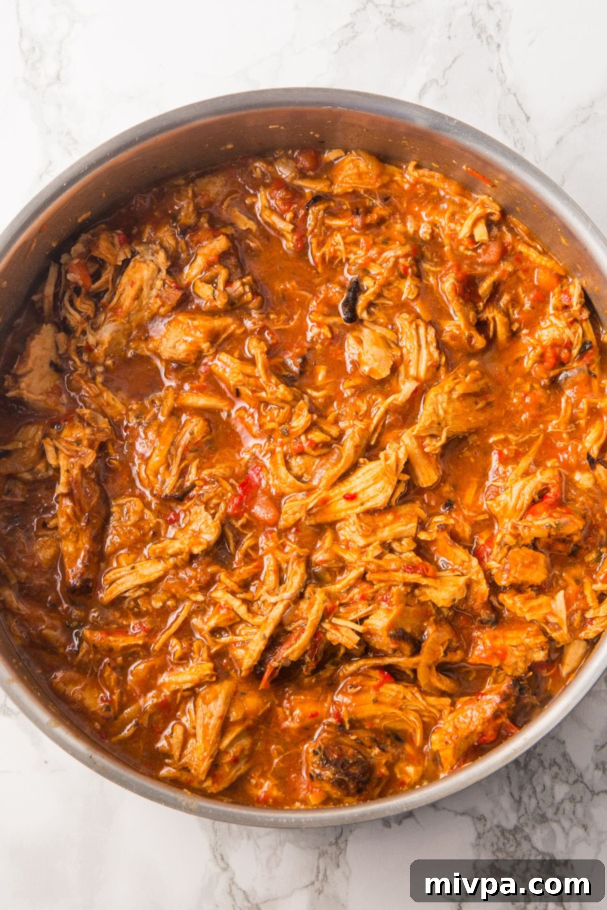 A pot full of gluten-free shredded pork