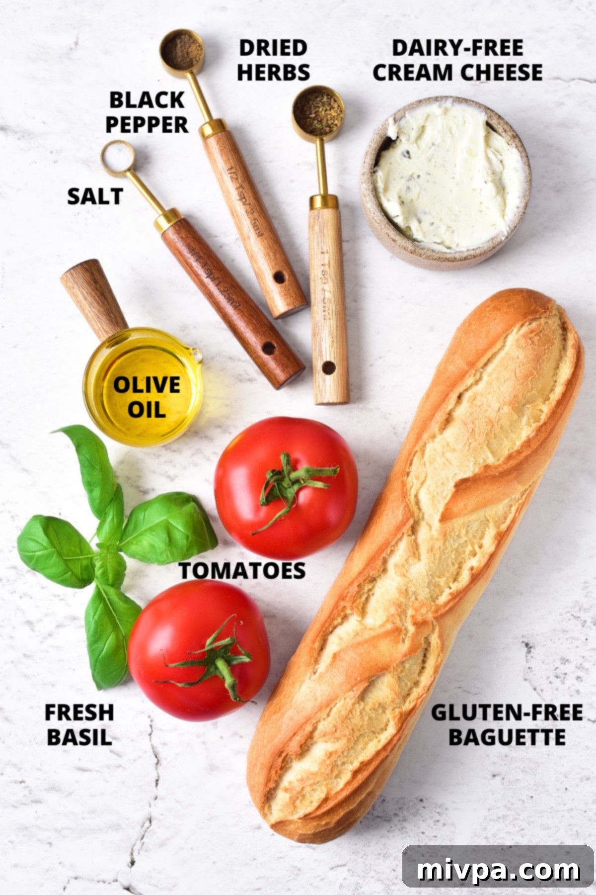 Easy Gluten-Free Bruschetta Recipe (Vegan) Ingredients for gluten-free bruschetta recipe laid out on marble board.