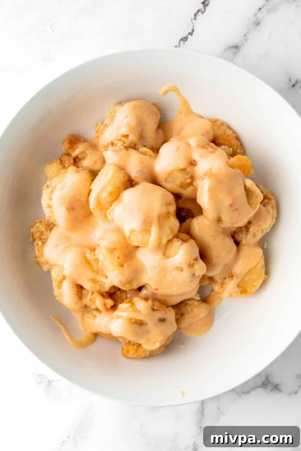How to Make Bang Bang Shrimp Bang Bang Sauce drizzled over fried shrimp