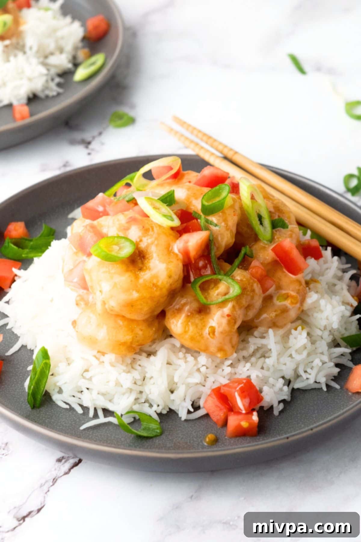 Easy Bang Bang Shrimp Recipe A plate of bang bang shrimp and rice