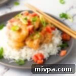 Guilt-Free Bang Bang Shrimp 2 A plate of bang bang shrimp served over rice.