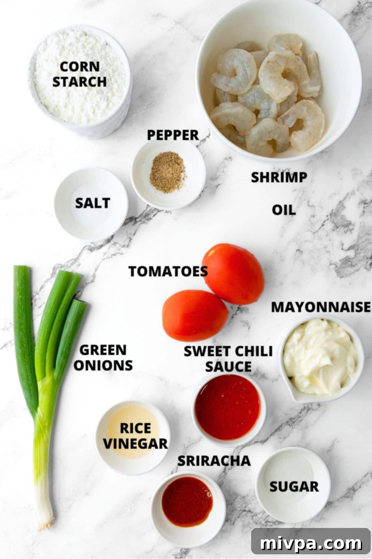 Gluten-Free Bang Bang Shrimp Recipe (Dairy-Free) Ingredients for gluten-free fried shrimp recipe laid out on marble board.