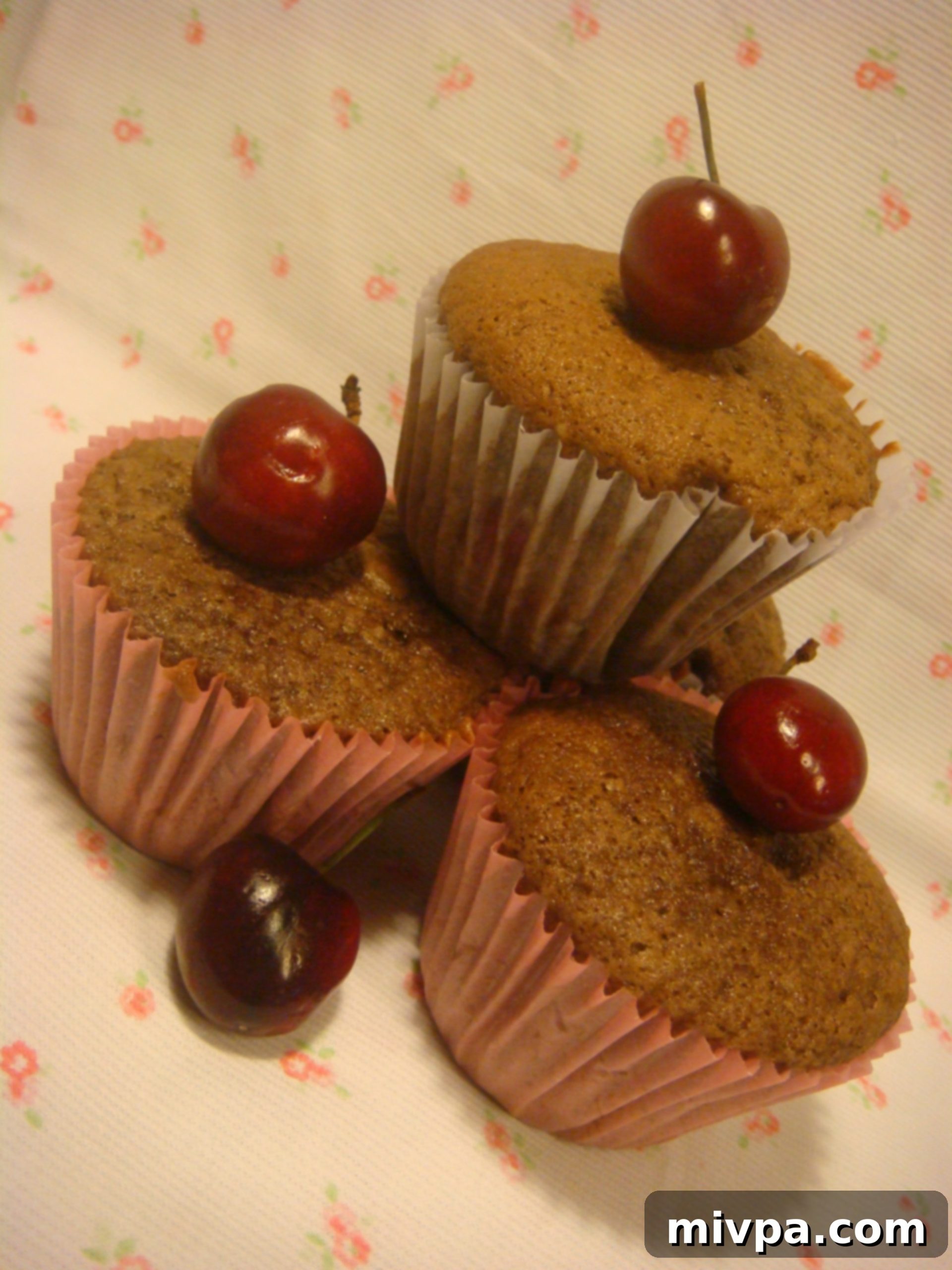 An inviting stack of freshly baked Cherry Chocolate Muffins, ready to be served and enjoyed, with a focus on their delicious appearance.