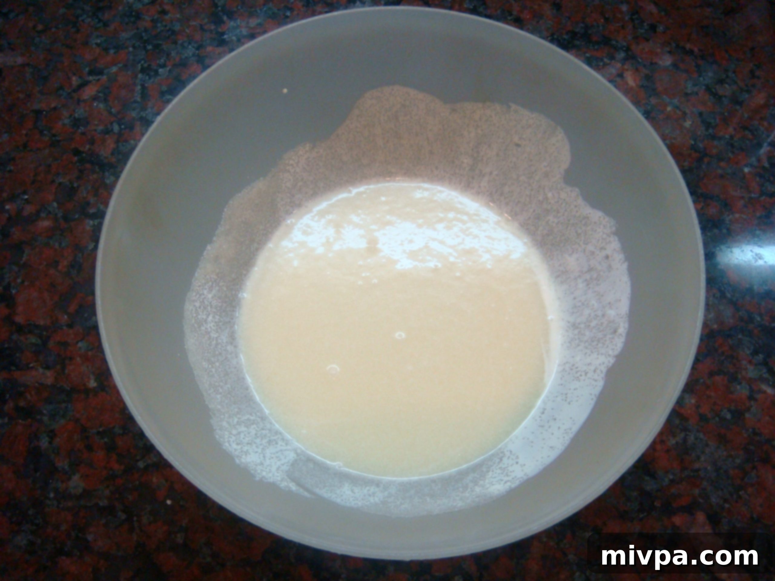 Chocolate Cherry Muffins 7 A smooth, creamy mixture of dissolved sugar and milk cream in a bowl.