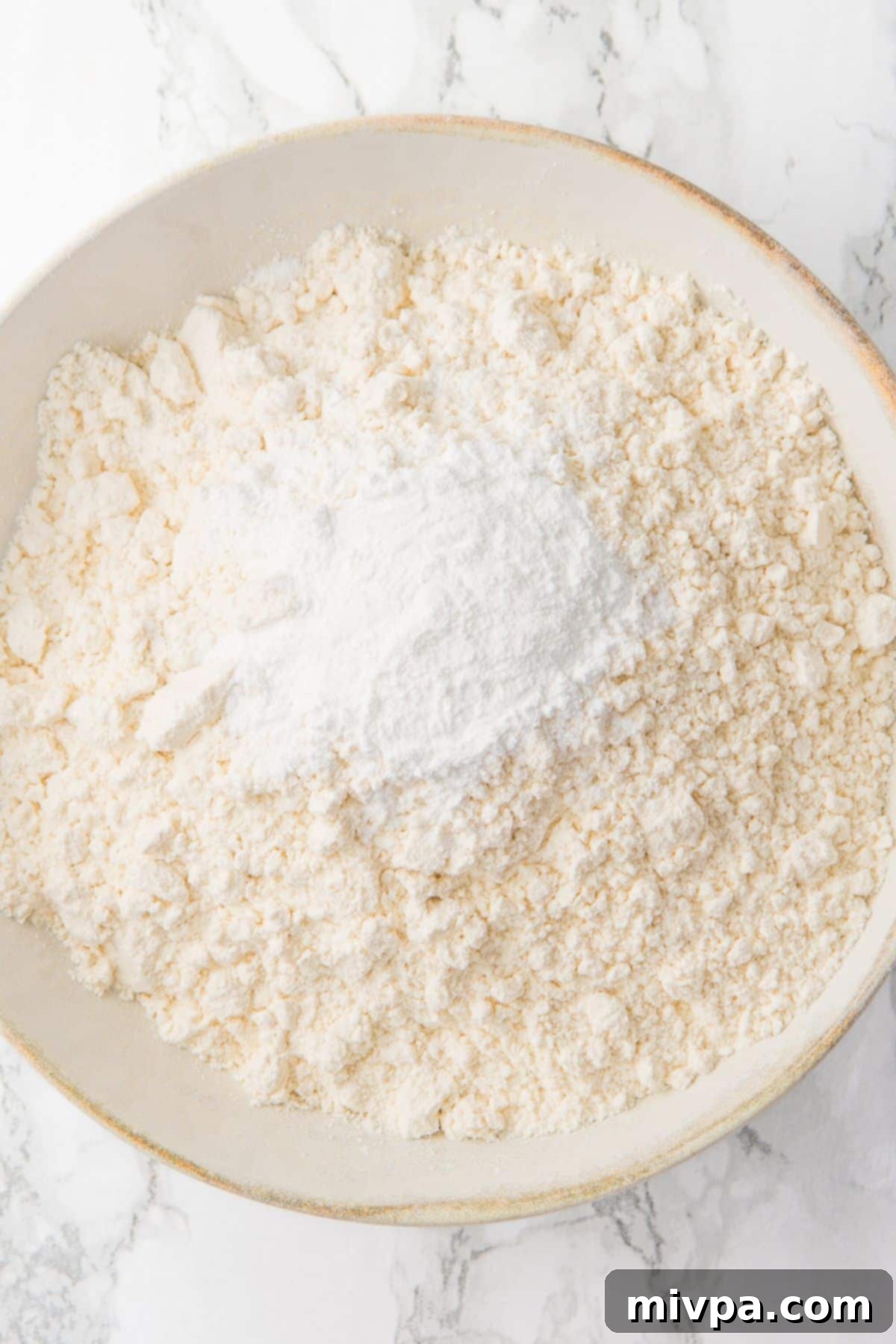 Gluten-Free Lemon Drizzle Cake (Dairy-Free) A bowl containing the sifted dry flour mixture.
