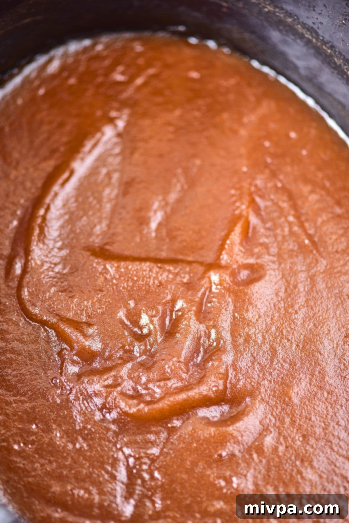 Up close view of apple butter in slow cooker