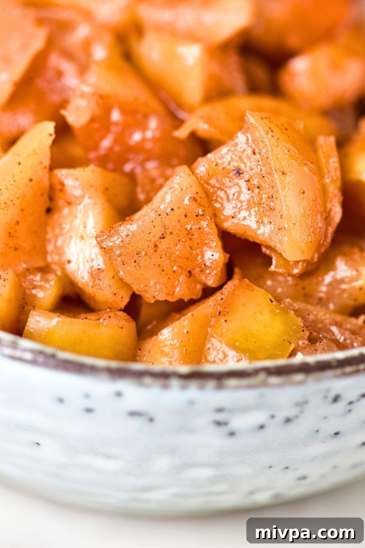 Caramelized Cinnamon Apples Up close view of a bowl of caramelized cinnamon apples