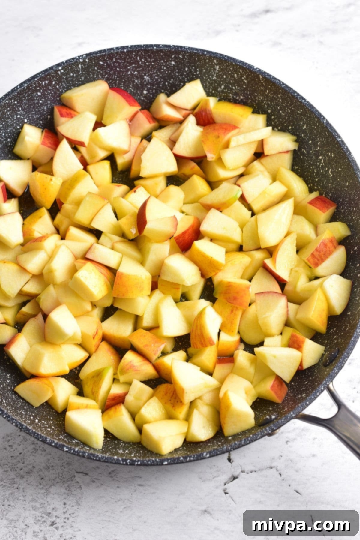Easy Caramelized Apples (Gluten-Free, Vegan) Cubed apples in skillet