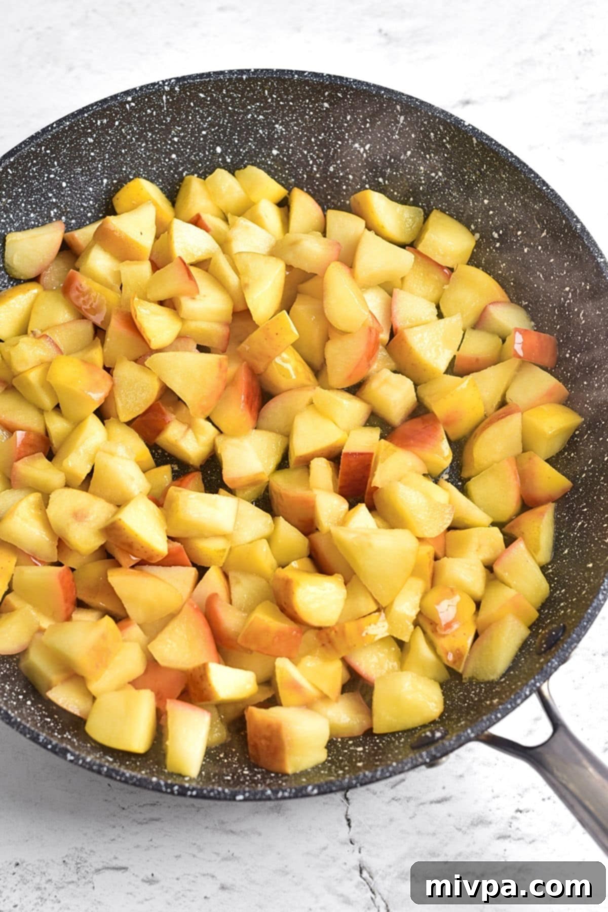 How to Make Caramelized Apples Cooking cubed apples in skillet