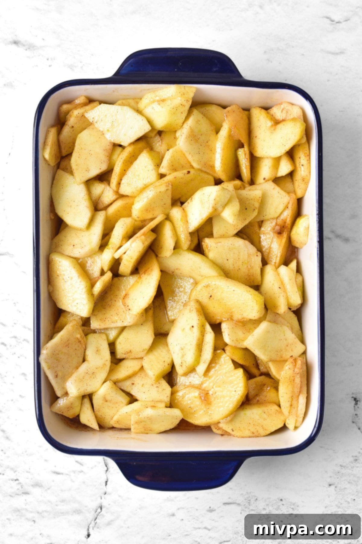 Sliced apples tossed with cinnamon