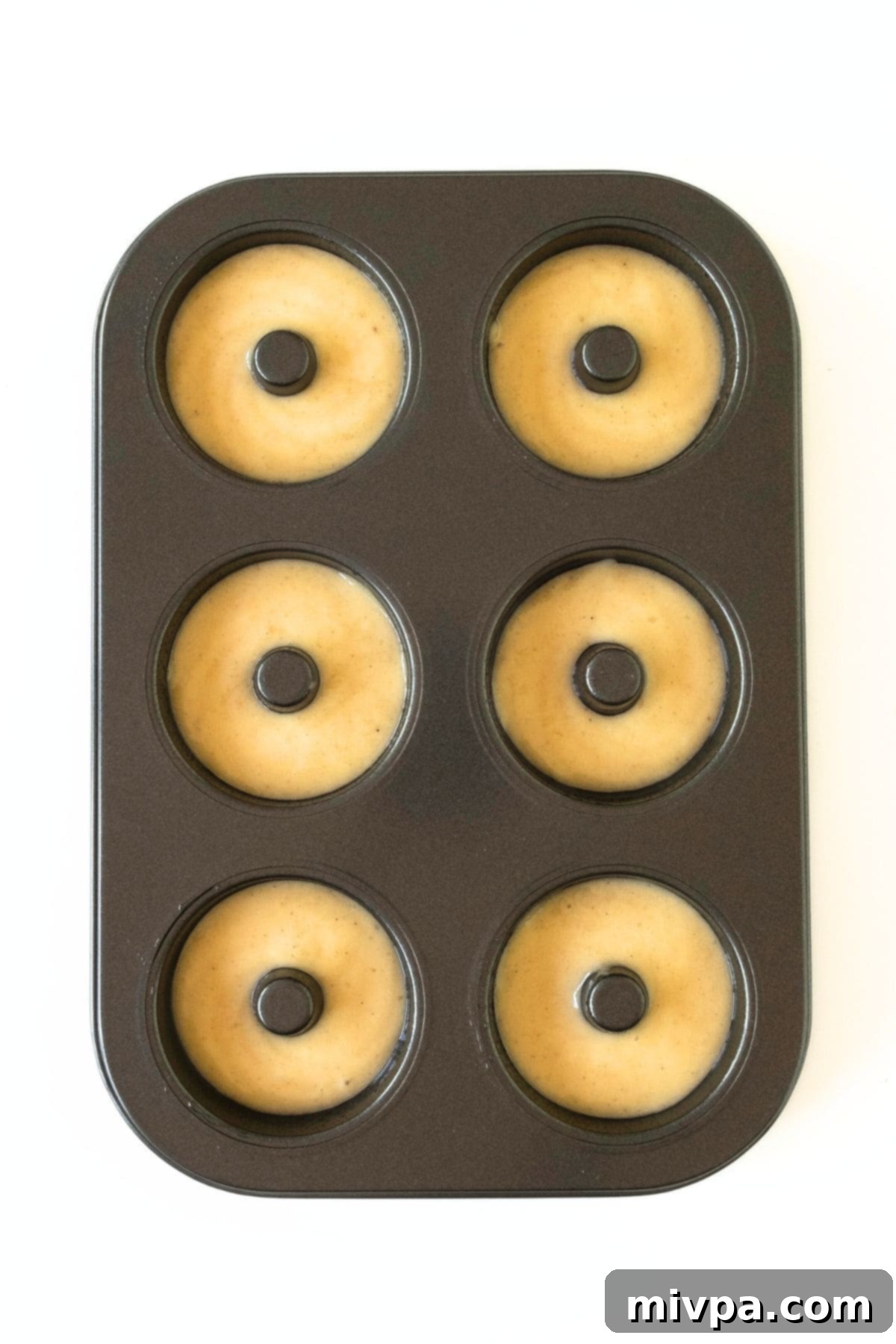 Donut batter in donut pan