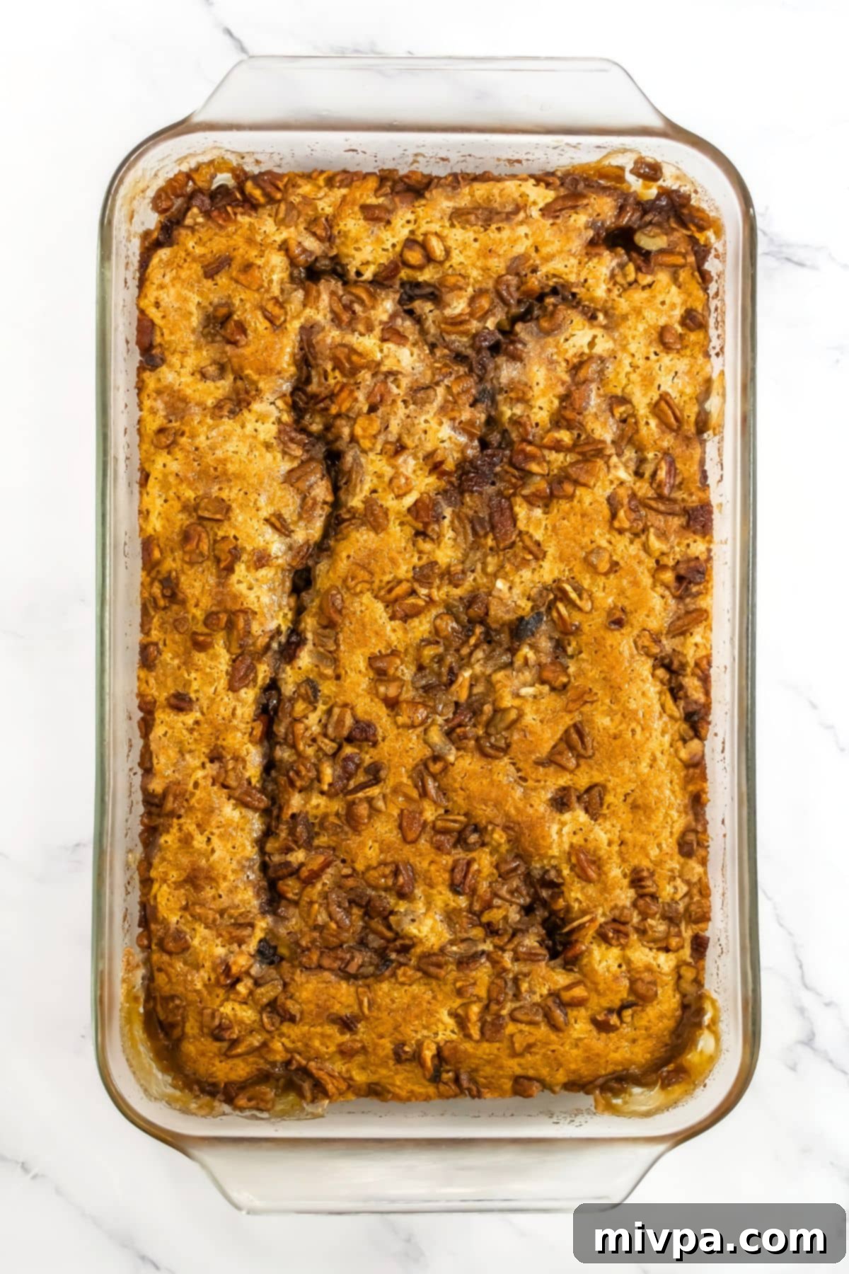 Freshly baked pumpkin cobbler topped with pecans