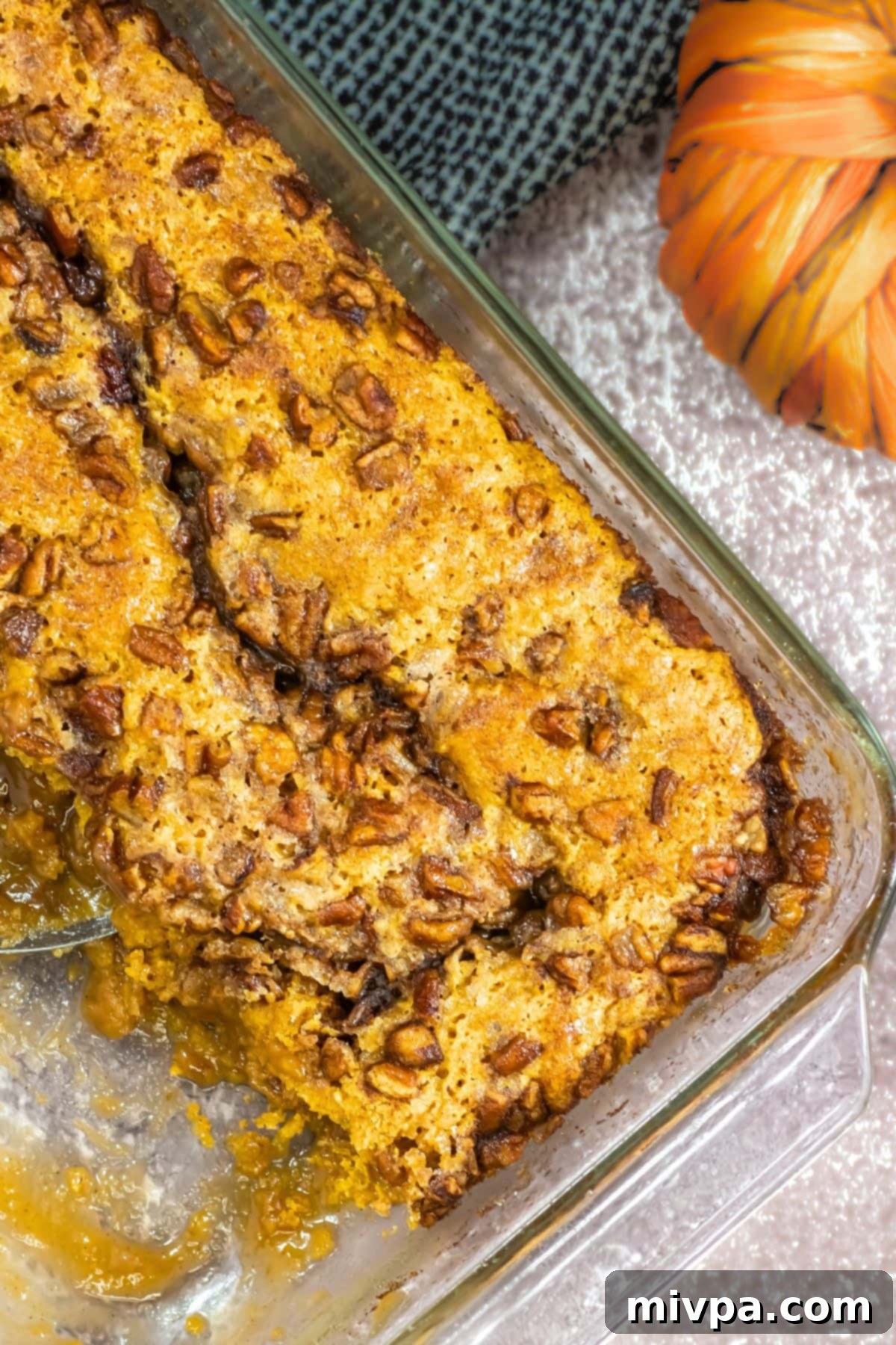 Top down view of pumpkin cobbler in glass baking dish