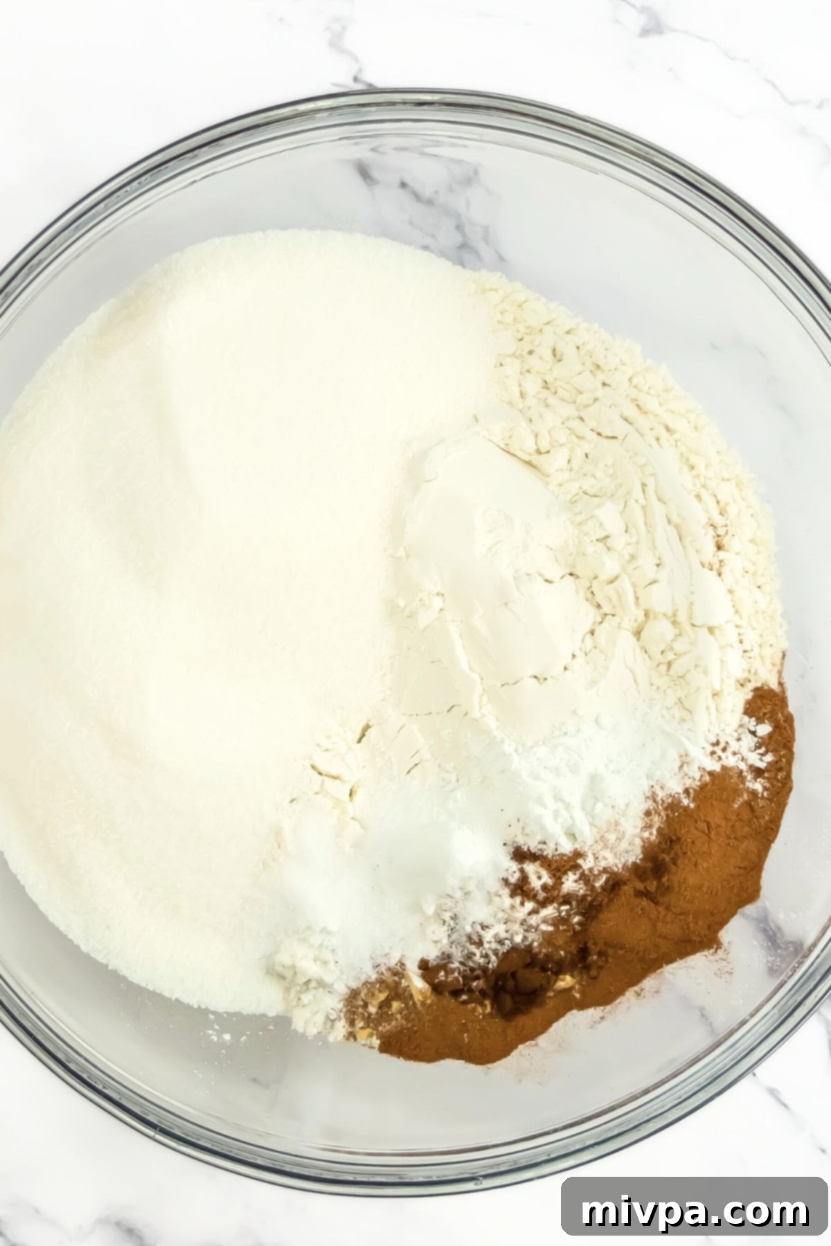 A bowl with flour mixture and spices.