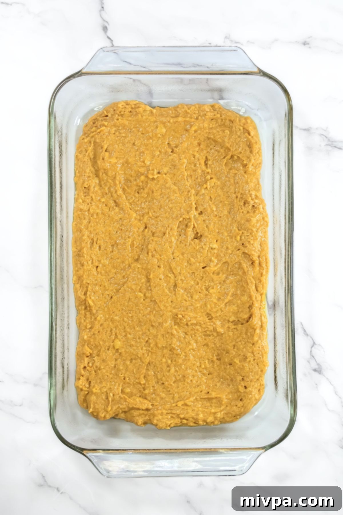 Pumpkin batter in glass baking dish