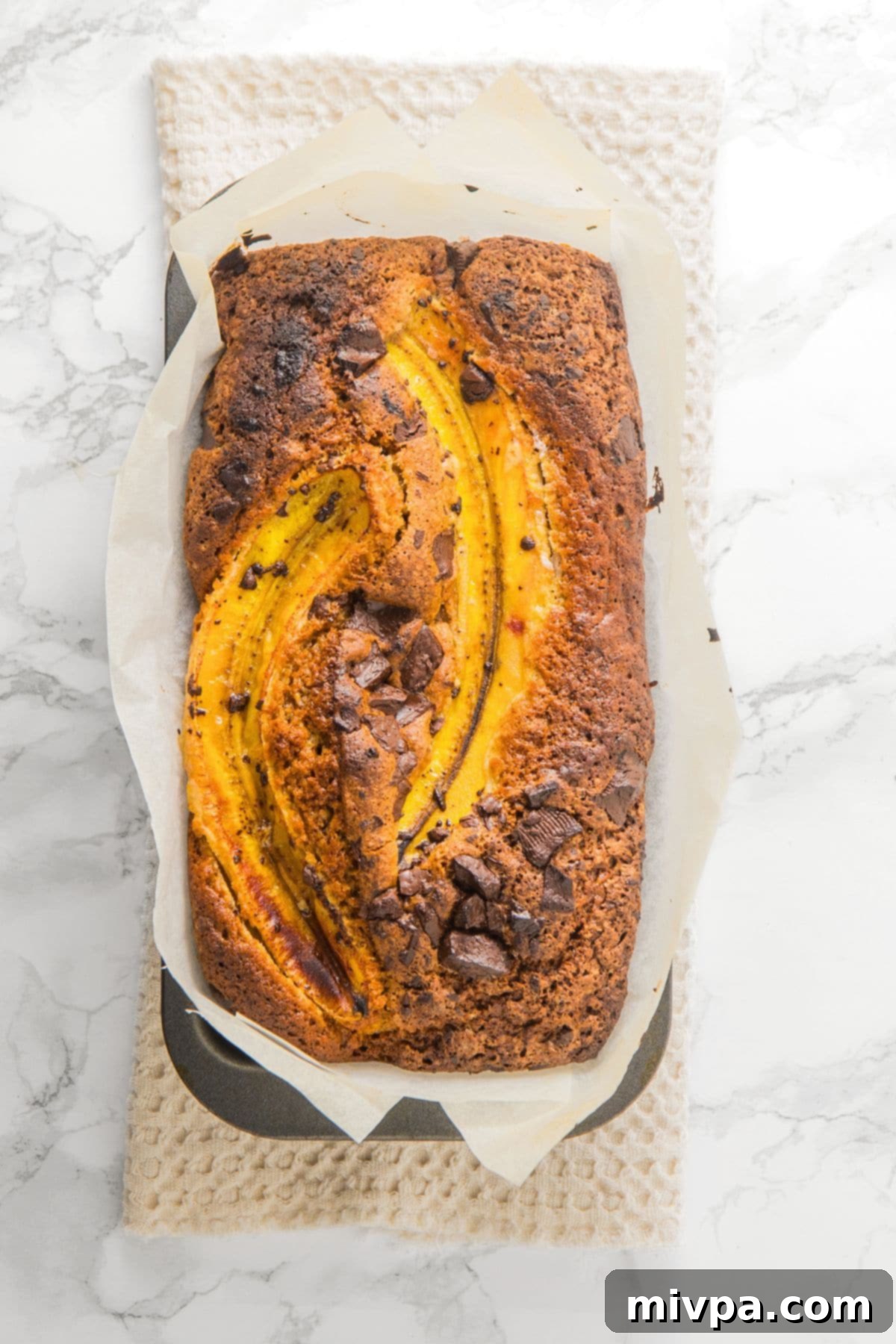 Freshly baked loaf of gluten-free chocolate chip banana bread