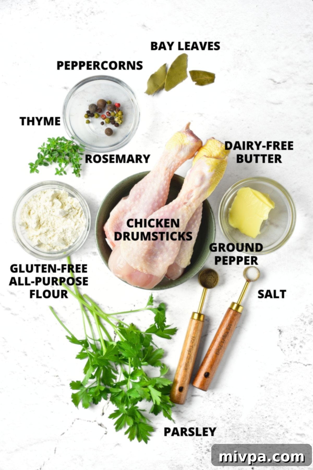 Ingredients for gluten-free chicken gravy recipe laid out on marble board.