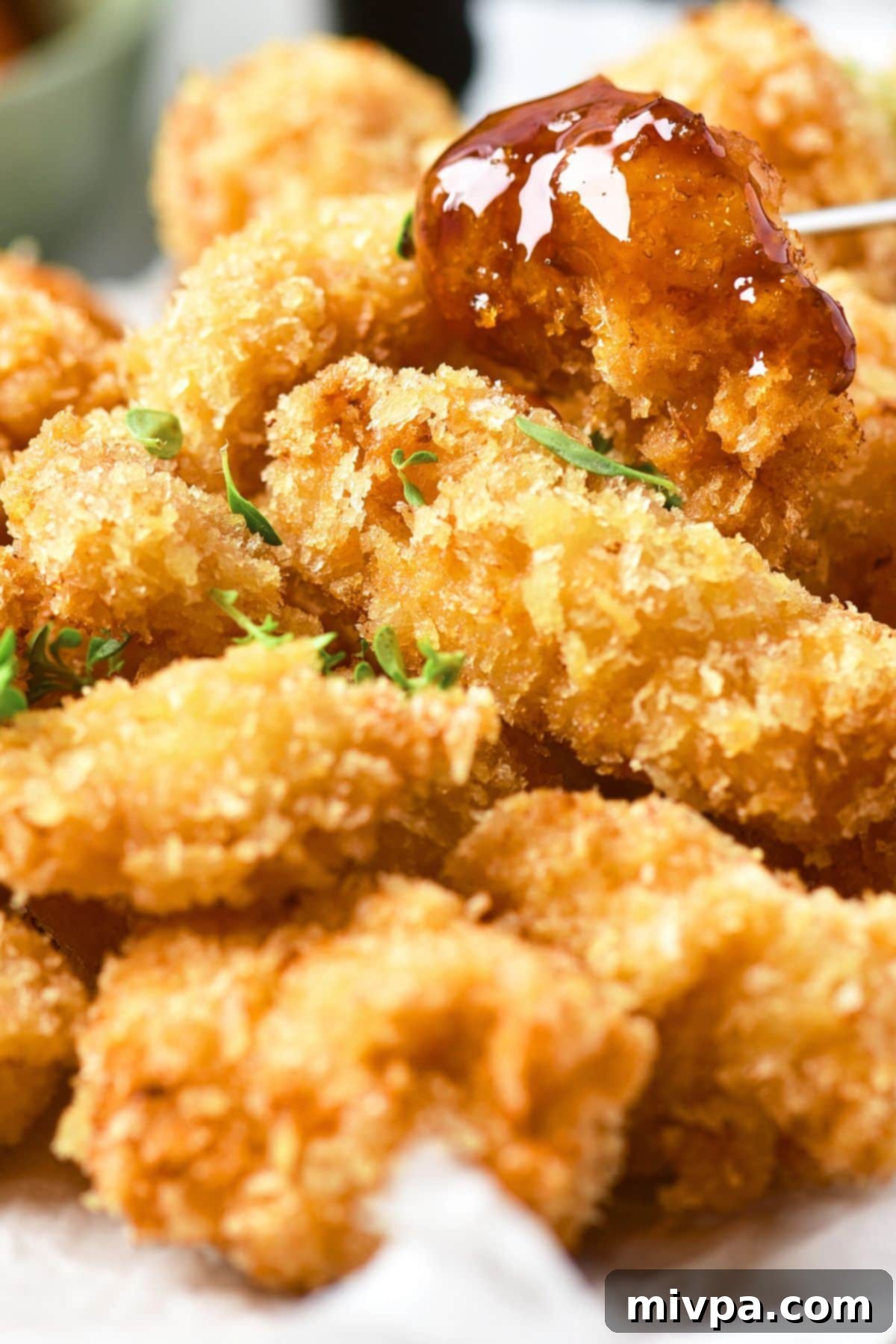 Gluten-Free Dairy-Free Chicken Nuggets Close-up view of golden, crispy gluten-free and dairy-free chicken nuggets, showing off their perfectly fried exterior.