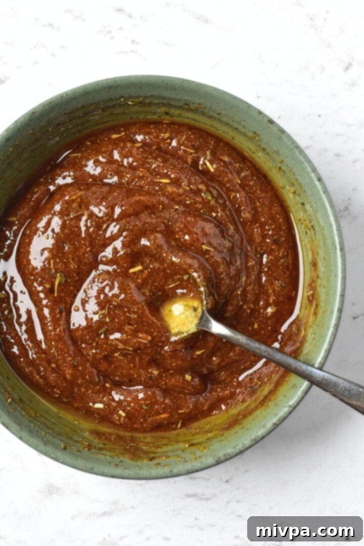 Turkey marinade with a spoon in a bowl