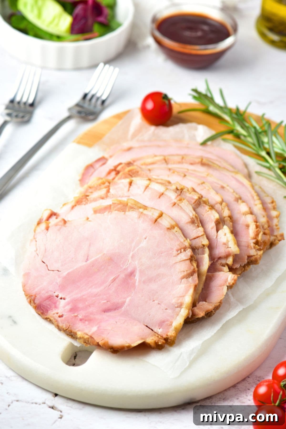 Sliced ham on marble cutting board