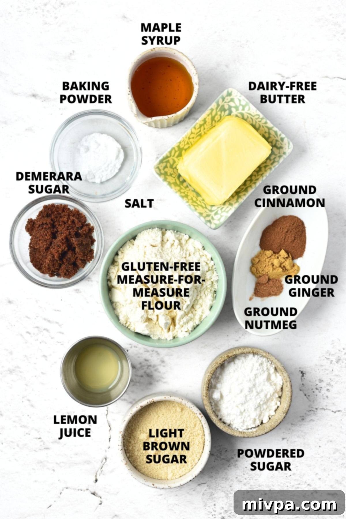 Easy Gluten-Free Gingerbread Men Recipe (Dairy-Free) Ingredients for gluten-free gingerbread men recipe laid out on marble board, showcasing all the necessary items.